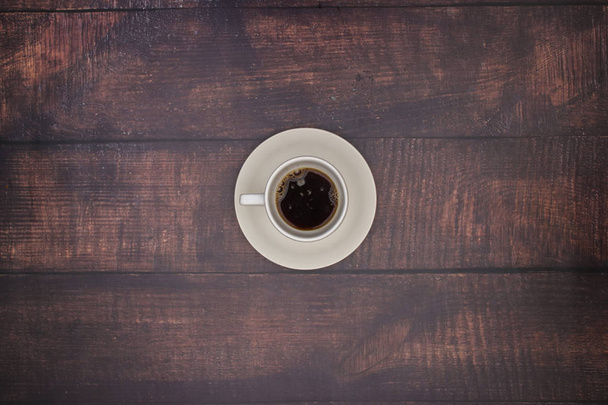 White cup of coffee on the wooden table  - Photo, image