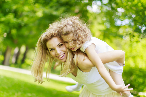 Mother and daughter in the park - Photo, Image