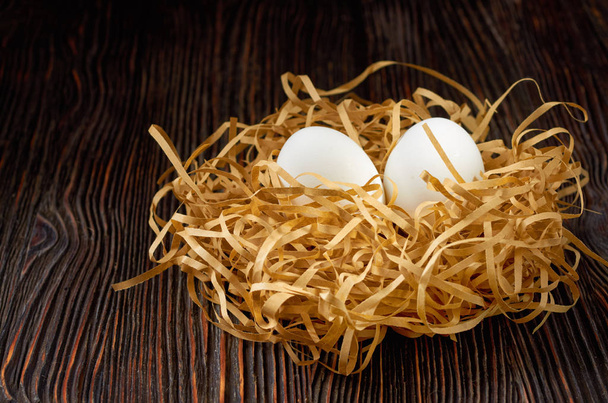 Fresh white eggs on the village table. Low key. - Photo, Image