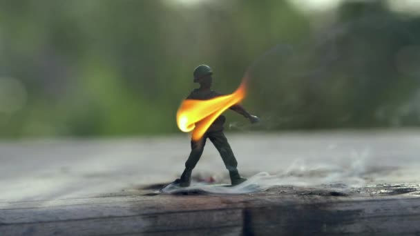 Toy soldier on fire. Slow motion - Footage, Video