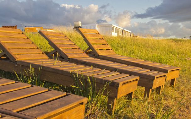 wooden deck chairs by the lake - Photo, Image