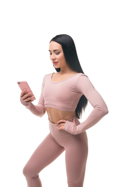 Sexy brunette in pink sportswear shot - Foto, immagini