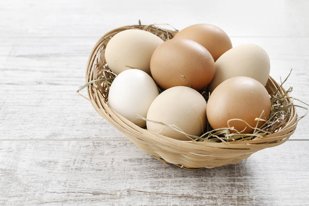 Wicker basket with eggs.  - Photo, image