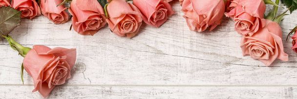 Big bouquet of roses on wooden background - Photo, Image