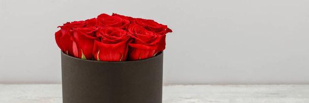Flower box with red roses. - Valokuva, kuva