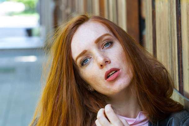 Red-haired girl with freckles and bright makeup - 写真・画像