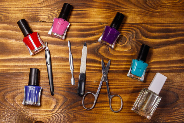 Basic set of manicure tools on wooden background - Photo, Image