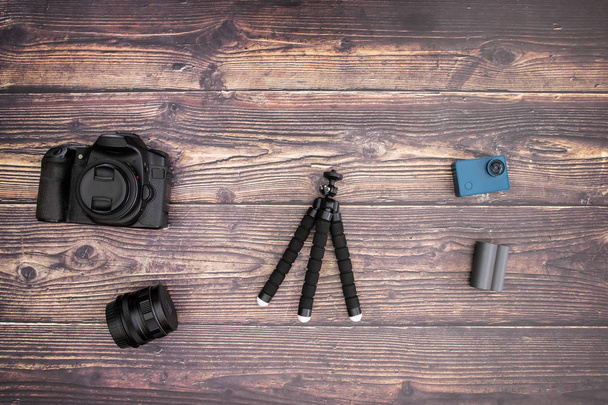 Travel kit and cameras on wooden background  - Foto, Imagem