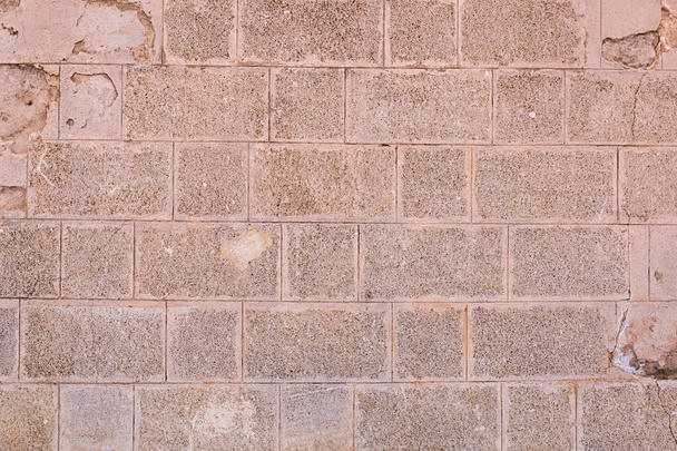 кам'яна стіна з прямокутних бруківки фону світло-коричневого твердого вивітрювання
 - Фото, зображення