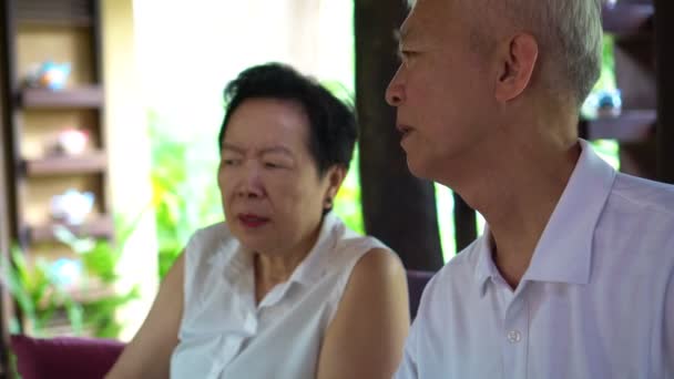 Asian senior couple discuss problems together - Felvétel, videó