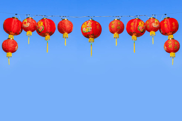 Red Chinese paper lanterns against a blue sky - Photo, Image