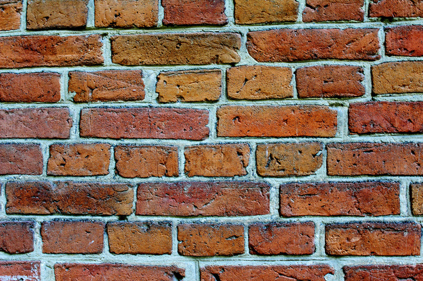 Fragment d'un mur de briques d'un ancien bâtiment
. - Photo, image