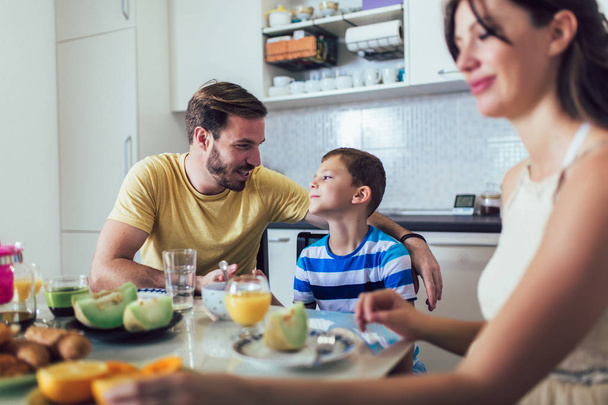 Family Eating Breakfast At Kitchen Table - Photo, Image