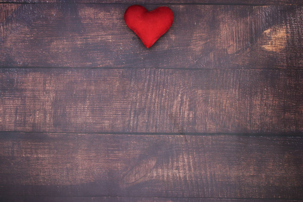Red heart on wooden table  - Fotó, kép