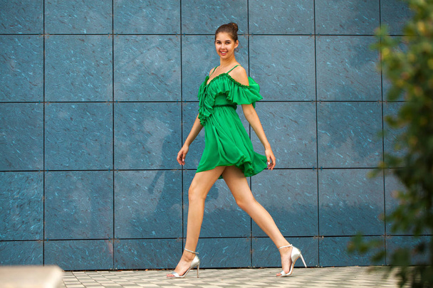 Full body portrait young beautiful brunette woman in green dress - Fotó, kép