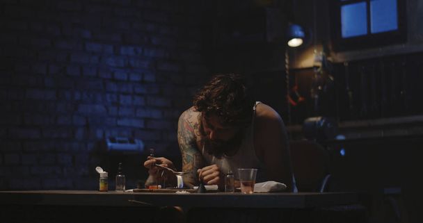 Man heating drug in a spoon - Fotó, kép
