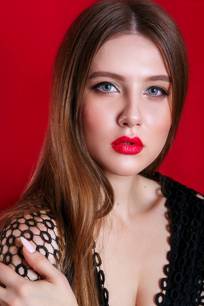 Close-up studio portrait of beautiful woman with bright make-up and red lips - Zdjęcie, obraz