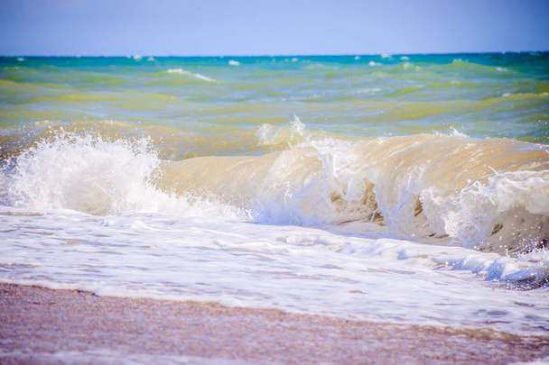 Sea waves. Sea of Crimea. High waves in clear weather. Sunny day at sea. Background blue sea waves. Sand beach. Clean beach. - Photo, Image