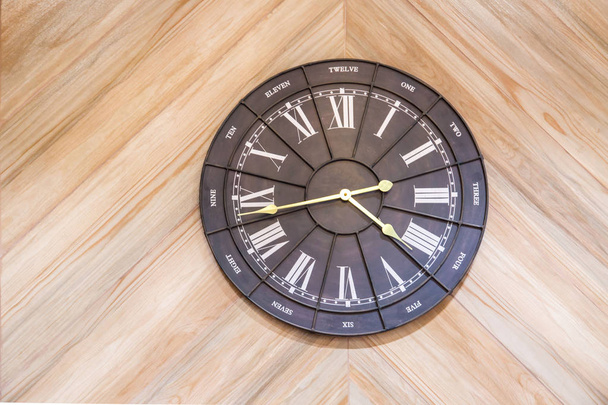 black and white clock shown on light wooden wall , - Photo, Image
