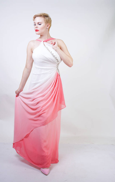 portrait of short-haired plump woman in pink evening dress - Foto, imagen
