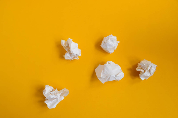 Crumpled paper balls on yellow background. Concept idea and creative - Zdjęcie, obraz