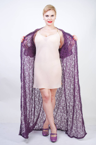 Beautiful woman in purple lace robe on white - Photo, Image