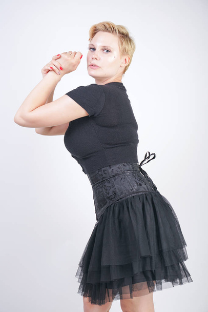 Portrait of beautiful girl in black corset goth dress - Valokuva, kuva
