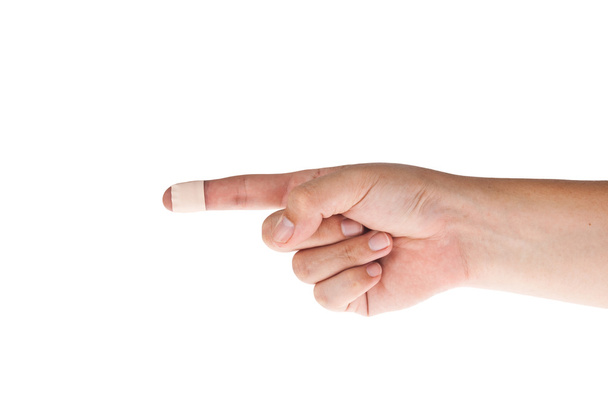 Finger with bandage point left - Foto, Imagen