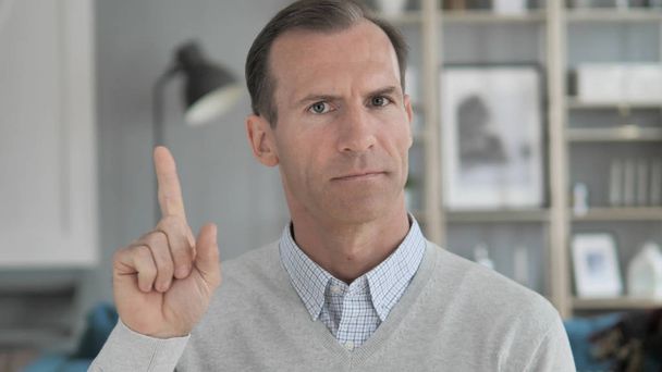 No, Middle Aged Man Rejecting Offer by Waving Finger - Фото, изображение