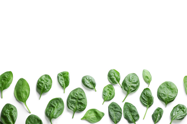 Fresh green healthy baby spinach leaves on white background, top view - Zdjęcie, obraz