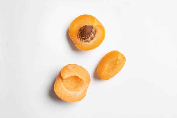 Delicious ripe sweet apricots on white background, top view - Photo, Image