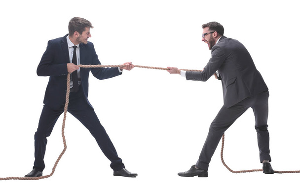 full length . two smiling businessmen pulling the rope. - Foto, immagini