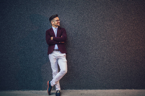 Portrait of modern young smiling businessman outdoor. - Foto, Imagem
