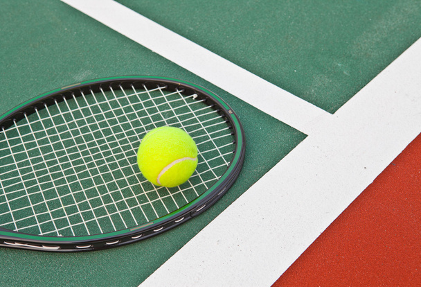 Tennis court at base line with ball and racket - Photo, Image