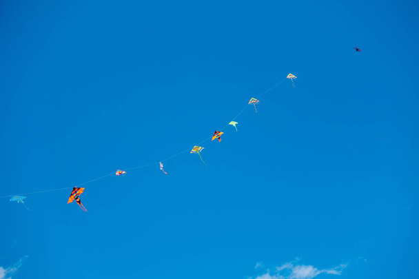 colorful stunt kites flying in the blue sky - Foto, Imagem