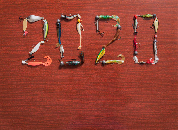 2020. Figures composed of baits for fishing - Foto, imagen