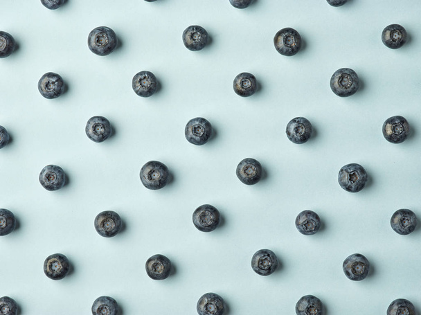 blueberry pattern on blue background - Photo, Image