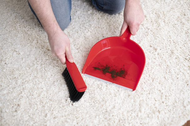 Swiping white carpet from dirty using broom - Photo, image