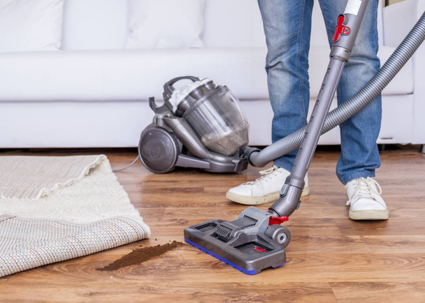 Dirty parquet and vacuuming the floor and carpet - Photo, Image