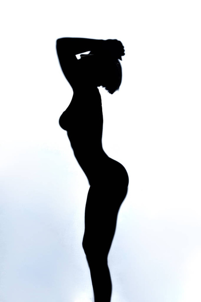 crying sad unhappy womans silhouette with raised arms above her head - Photo, image