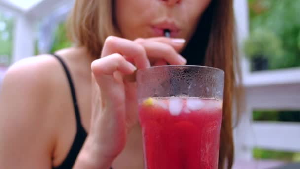 Woman sitting In terrace drink cold cocktail. - Filmmaterial, Video