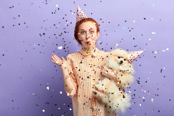 woman throwing arty for her adorable pet - Photo, Image
