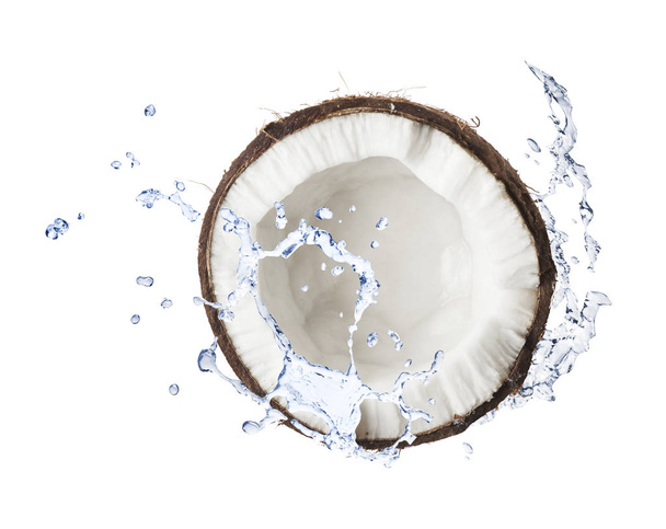 Cracked coconut with water splashes on whitebackround - Foto, afbeelding