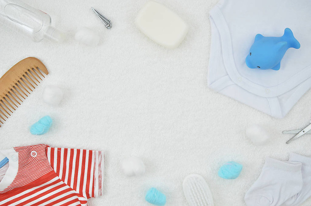 Top view baby shower party mockup with blue baby accessories on white background. Copy space for text. Flat lay. Its a boy concept - 写真・画像