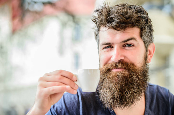 Bearded man in cafe. morning breakfast. brutal male needs morning refreshment. drink espresso coffee. Happy. Mature hipster with beard hair drinking coffee. Start up concept - Foto, afbeelding