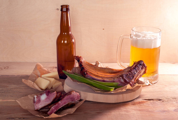 Smoked pork ribs with light beer and cheese - Photo, image