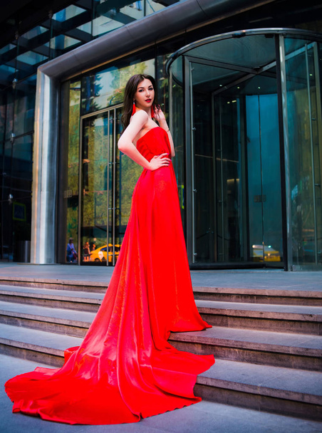 Attractive woman in red dress. - Zdjęcie, obraz