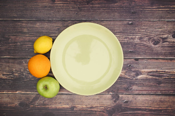 Fruits around the green plate - Fotografie, Obrázek