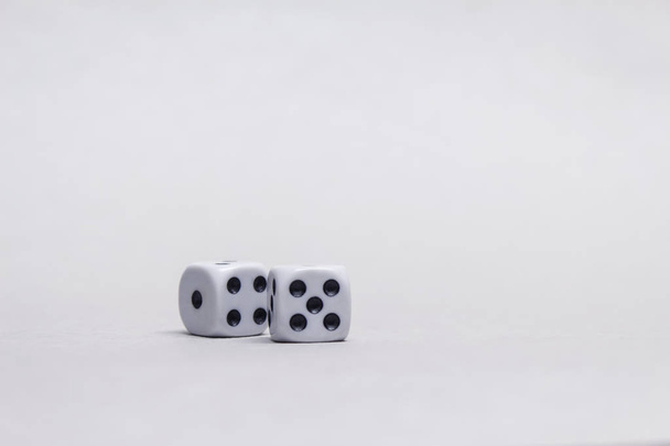 Two square cubes for gambling dice on a light background. - Photo, image