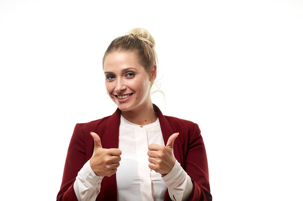 Confident young businesswoman showing thumbs up, isolated on white background - Photo, image